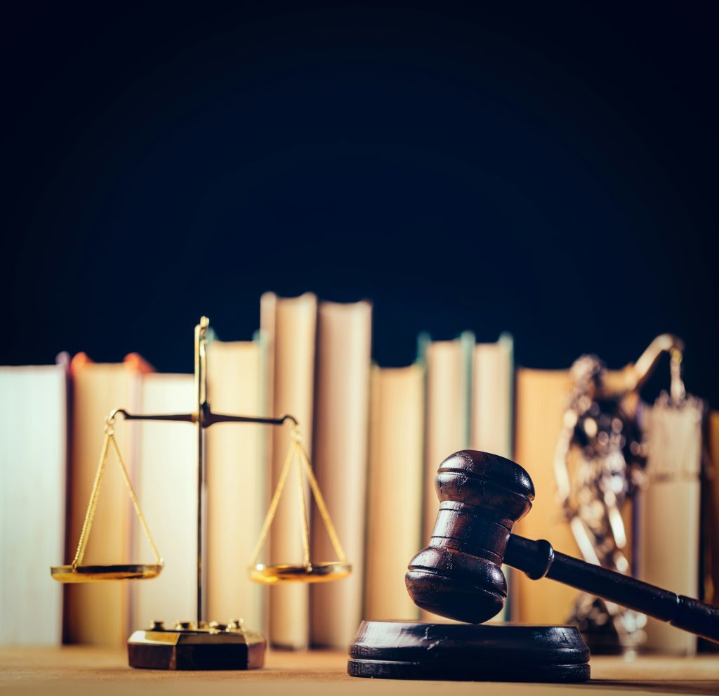 Symbols of law - scale, hammer and Themis
