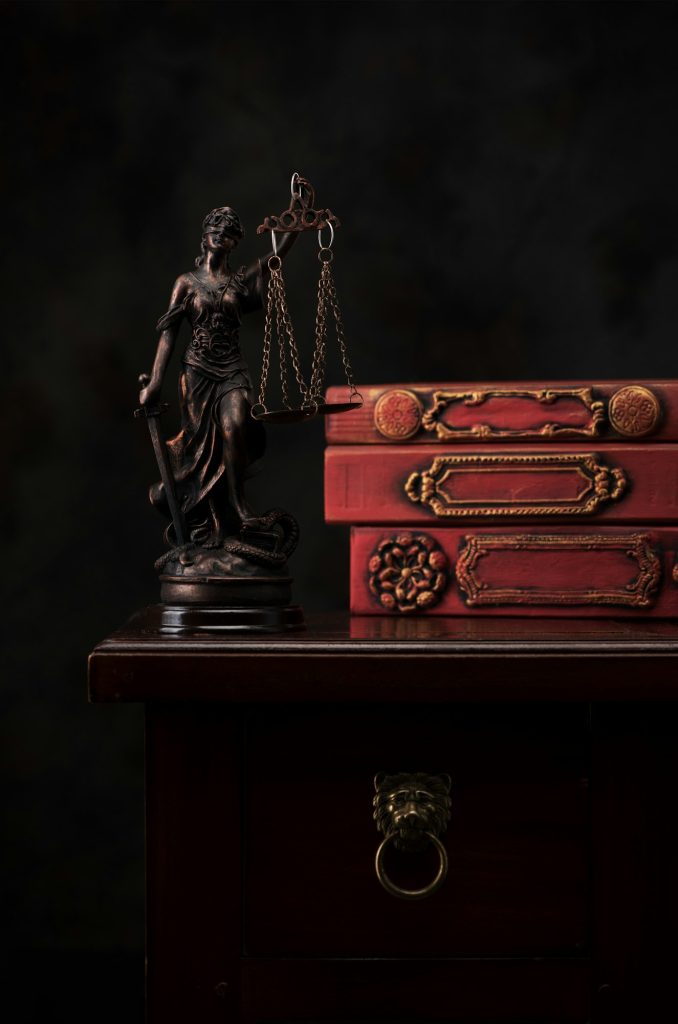 Legal law concept. Statue Justice on the background old books in the library